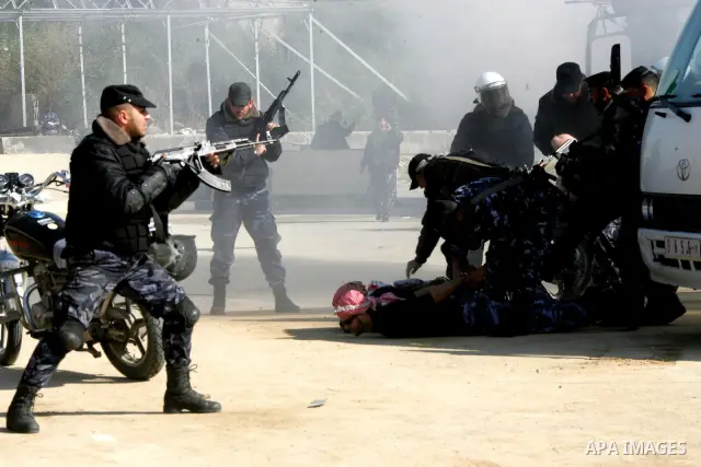 Hamas police officers display their skills during a graduation ceremony from a military course in the southern Gaza Strip city of Khan Yunis on January 29, 2012. Photo by Abed Rahim Khatib