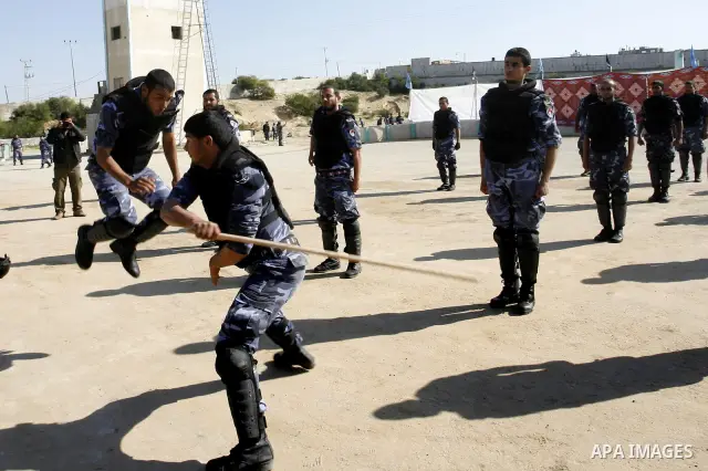 Hamas police officers display their skills during a graduation ceremony from a military course in the southern Gaza Strip city of Khan Yunis on January 29, 2012. Photo by Abed Rahim Khatib