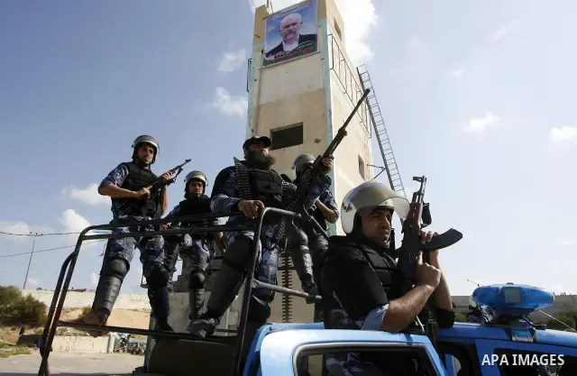 Hamas police officers display their skills during a graduation ceremony from a military course in the southern Gaza Strip city of Khan Yunis on January 29, 2012. Photo by Abed Rahim Khatib