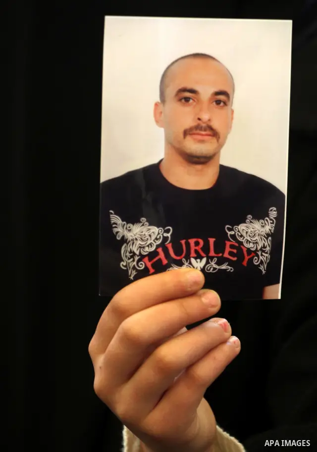 Palestinians hold pictures of their prisoned relatives in Israeli jails as they gather in a weekly activity calling for their liberty at the Red Cross headquarters in Gaza City, on Jan. 30, 2012. Photo by Mohammed Asad