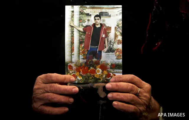 Palestinians hold pictures of their prisoned relatives in Israeli jails as they gather in a weekly activity calling for their liberty at the Red Cross headquarters in Gaza City, on Jan. 30, 2012. Photo by Ali Jadallah