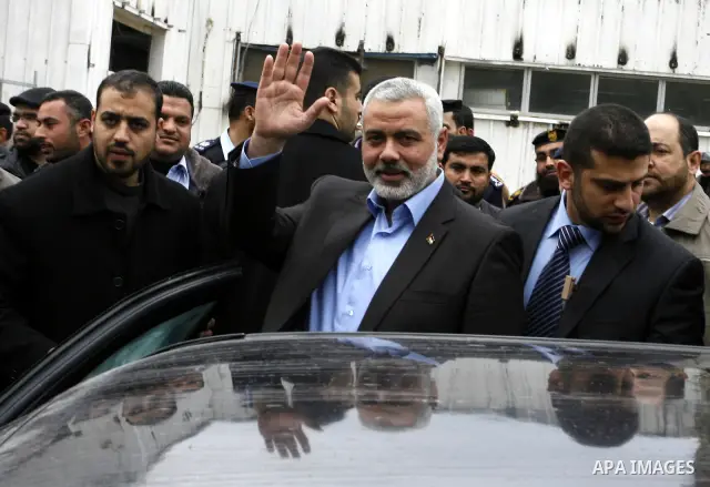 Palestinian Prime Minister in Gaza Strip, Ismail Haniya, arrived to the Rafah border crossing in the southern Gaza Strip on Jan. 30, 2012. as he leaves on a regional tour expected to include stops in Iran, Qatar and Bahr...