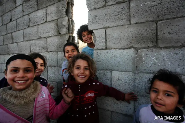 Palestinian children, from a Bedouin family, paly during low winter temperatures inside their family's tent in Gaza's Zeitoun neighbourhood January 31, 2012. Photo by Mahmud Nassar