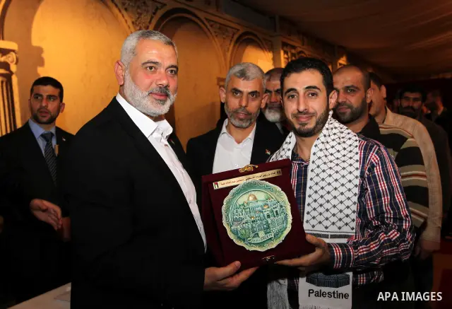 Palestinian Prime Minister in Gaza Strip, Ismail Haniyah receives released prisoners, deported to the Qatar, in the Qatari capital of Doha on Jan. 31,2012. photo by Mohammed Al-Ostaz
