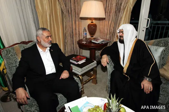 Palestinian Prime Minister in Gaza Strip, Ismail Haniyah meets with Secretary General of the International Union for Muslims Scholars Dr. Ali Mohi El-dein Qara Daghi in the Qatari capital of Doha on Jan. 31,2012. Photo b...