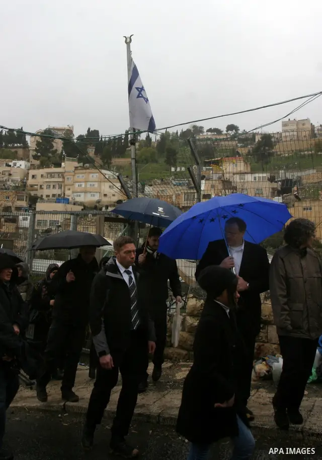 Germany's Minister for Economic Cooperation and Development Dirk Niebel speaks with a local dignitary during a visit to the Palestinian in silwan neighbourhood of jerusalem, on february 1, 2012. Photo by Mahfouz Abu Turk