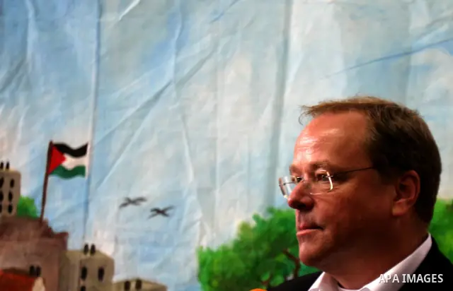 Germany's Minister for Economic Cooperation and Development Dirk Niebel speaks with a local dignitary during a visit to the Palestinian in silwan neighbourhood of jerusalem, on february 1, 2012. Photo by Mahfouz Abu Turk