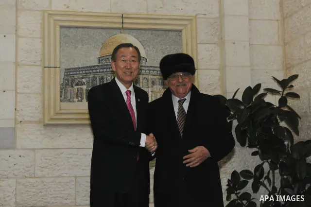 Palestinian President Mahmoud Abbas (R) shakes hands with U.N. Secretary-General Ban Ki-moon (L) during their meeting in the West Bank city of Ramallah on Feb. 1, 2012. Photo by Thaer Ghanaim