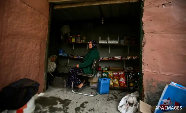 Palestinians shop at a traditional market during the heavy rain of the winter in Gaza city on Feb. 02, 2012. Photo by Ali Jadallah