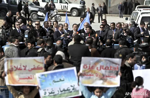UN secretary general Ban Ki-moon speaks during a press conference as he visits the construction site of a housing project in Khan Yunis in the southern Gaza Strip on February 2, 2012. Protesters threw shoes, sand and sma...