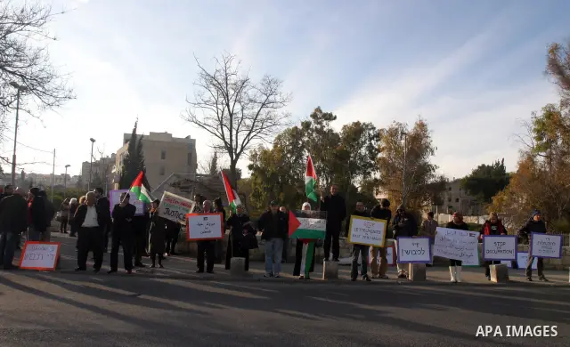 Palestinian, foreign and Israeli left-wing activists participate in a demonstration in the east Jerusalem neighborhood of Sheikh Jarrah, Friday, Feb. 03, 2012. The protest was organized by groups supporting Palestinians...