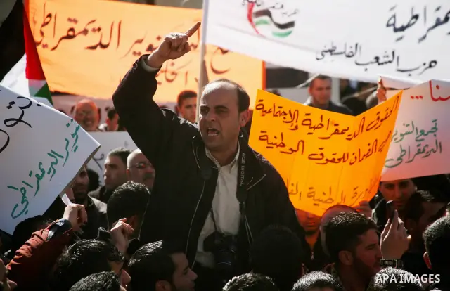 Palestinians protest against rising prices and taxes in the West Bank city of Hebron. Saturday, Feb. 4, 2012. Palestinian Authority Prime Minister Salam Fayyad has sparked a furor with a push to get Palestinians to pay m...