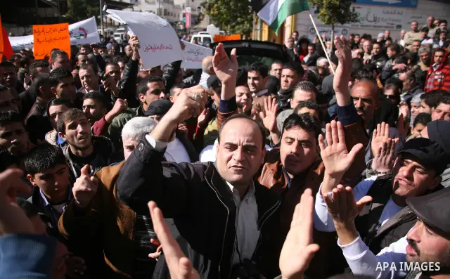 Palestinians protest against rising prices and taxes in the West Bank city of Hebron. Saturday, Feb. 4, 2012. Palestinian Authority Prime Minister Salam Fayyad has sparked a furor with a push to get Palestinians to pay m...