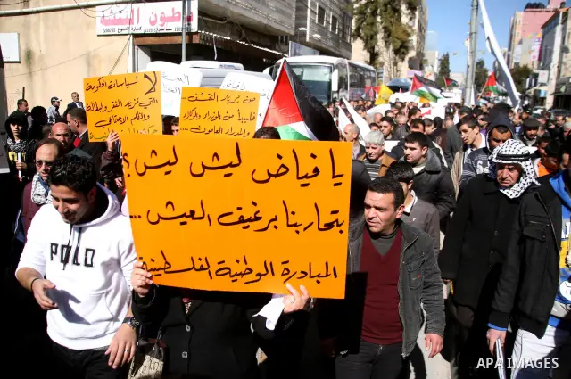Palestinians protest against rising prices and taxes in the West Bank city of Hebron. Saturday, Feb. 4, 2012. Palestinian Authority Prime Minister Salam Fayyad has sparked a furor with a push to get Palestinians to pay m...
