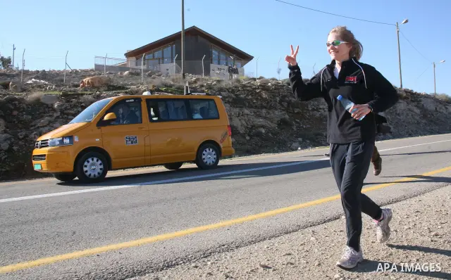 Palestinians, Israeli and foreign activists run during a marathon to support the farmers and land owners in the West Bank city of Hebron on Feb. 4,2012. Israeli troops detained a Palestinian and two foreign activists . P...