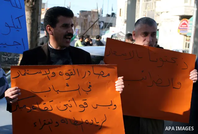Palestinians protest against rising prices and taxes in the West Bank city of Ramalllah, Saturday, Feb. 4, 2012. Palestinian Authority Prime Minister Salam Fayyad has sparked a furor with a push to get Palestinians to pa...
