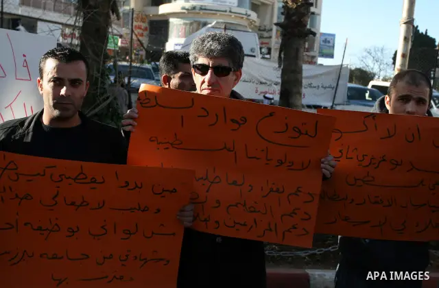 Palestinians protest against rising prices and taxes in the West Bank city of Ramalllah, Saturday, Feb. 4, 2012. Palestinian Authority Prime Minister Salam Fayyad has sparked a furor with a push to get Palestinians to pa...