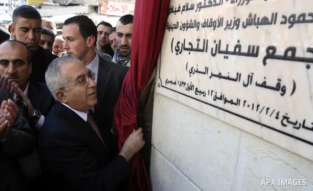 Palestinian Prime Minister Salam Fayyad visits the West Bank city of Nablus. Saturday, Feb. 4 , 2012. Palestinians protested Saturday in the West Bank against higher taxes and prices hike and demanded the Prime Minister...