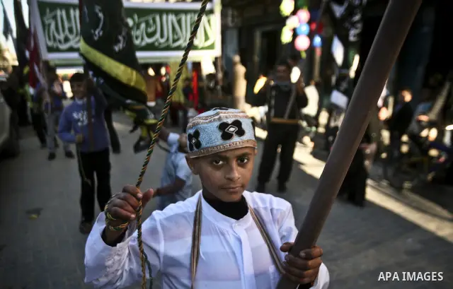 Members of a palestinian Sufi Muslim group play traditional instruments during the birthday of Prophet Mohammad, in Al-Nusirat refugee camp on 04 February 2012. Muslims across the world celebrated the birth of the Prophe...