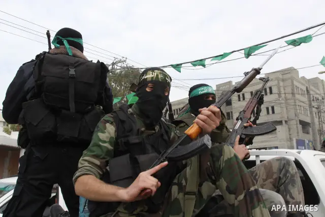 Members of Al-Qassam Brigades take part in a funeral for Hamas fighter in Gaza City, on Feb, 06. 2012. Photo by Mohammed Asad
