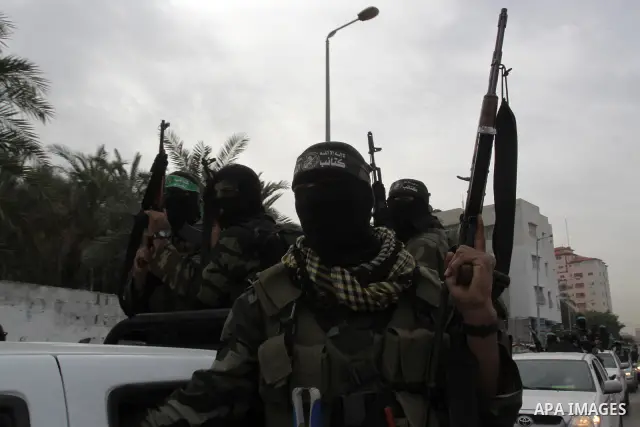 Members of Al-Qassam Brigades take part in a funeral for Hamas fighter in Gaza City, on Feb, 06. 2012. Photo by Mohammed Asad