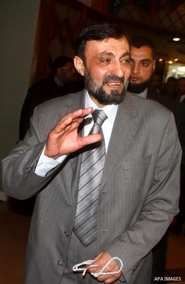 A Palestinian member of Hamas movement political bureau, Emad Al-Alami is welcomed by Hamas movement leaders and others after his arrival to Gaza Strip, in Gaza city on Feb. 6,2012. Al-Almi returned to Gaza Strip on Mond...