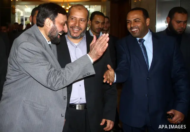 A Palestinian member of Hamas movement political bureau, Emad Al-Alami is welcomed by Hamas movement leaders and others after his arrival to Gaza Strip, in Gaza city on Feb. 6,2012. Al-Almi returned to Gaza Strip on Mond...