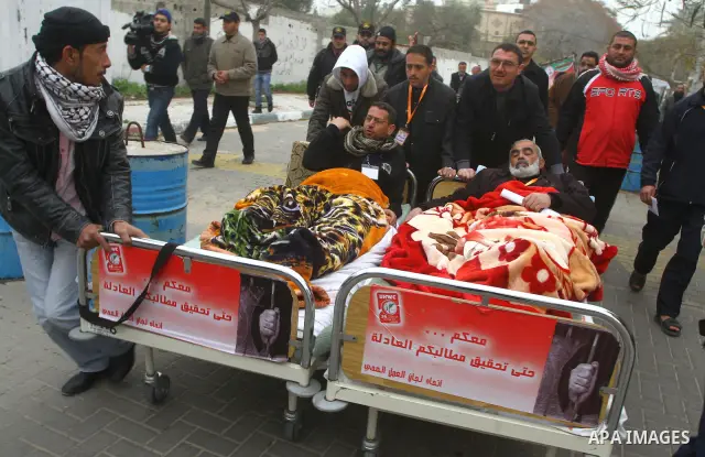 Palestinians on a hunger strike in solidarity with the prisoners in Israeli jails in front of the UN headquarters in Gaza City, on Feb. 07, 2012. Photo by Ashraf Amra