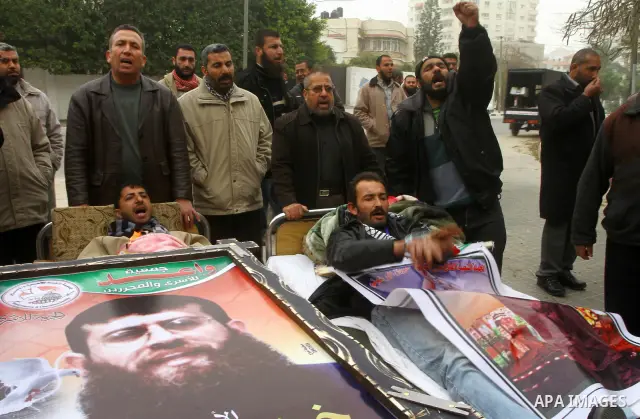 Palestinians on a hunger strike in solidarity with the prisoners in Israeli jails in front of the UN headquarters in Gaza City, on Feb. 07, 2012. Photo by Ashraf Amra