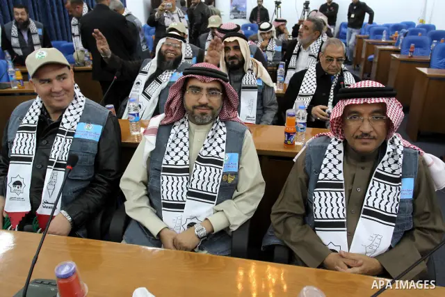 The spokesman of the Palestinian parliament, Ahmed Bahr meets with members of the "Miles of Smiles 9" aid convoy at the parliament headquarters in Gaza city on Feb. 07, 2012. The convoy, carrying medical aid for the Pale...