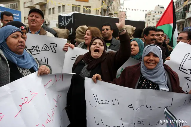 Palestinians demonstrate in solidarity with Khader Adnan, a senior member of Islamic Jihad jailed in Israel, who has been on a hunger strike for over seven weeks, during a protest in the West Bank city of Ramallah, Tuesd...