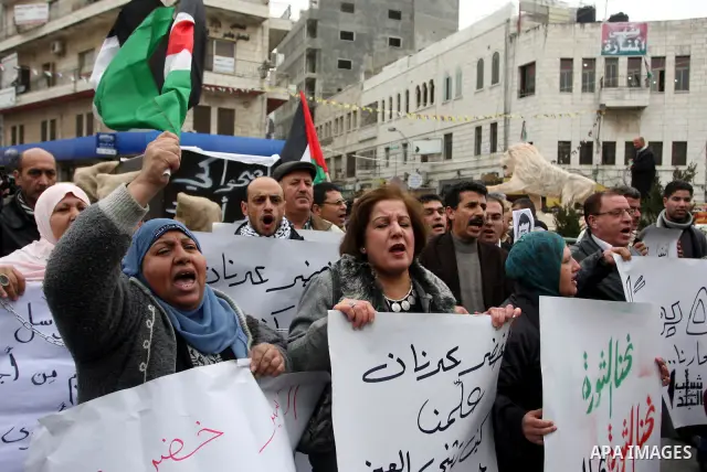 Palestinians demonstrate in solidarity with Khader Adnan, a senior member of Islamic Jihad jailed in Israel, who has been on a hunger strike for over seven weeks, during a protest in the West Bank city of Ramallah, Tuesd...