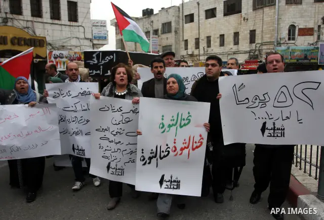 Palestinians demonstrate in solidarity with Khader Adnan, a senior member of Islamic Jihad jailed in Israel, who has been on a hunger strike for over seven weeks, during a protest in the West Bank city of Ramallah, Tuesd...
