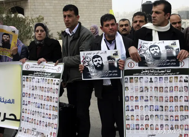Palestinians demonstrate in solidarity with Khader Adnan, a senior member of Islamic Jihad jailed in Israel, who has been on a hunger strike for over seven weeks, during a protest in the West Bank city of Nablus, Feb. 7,...