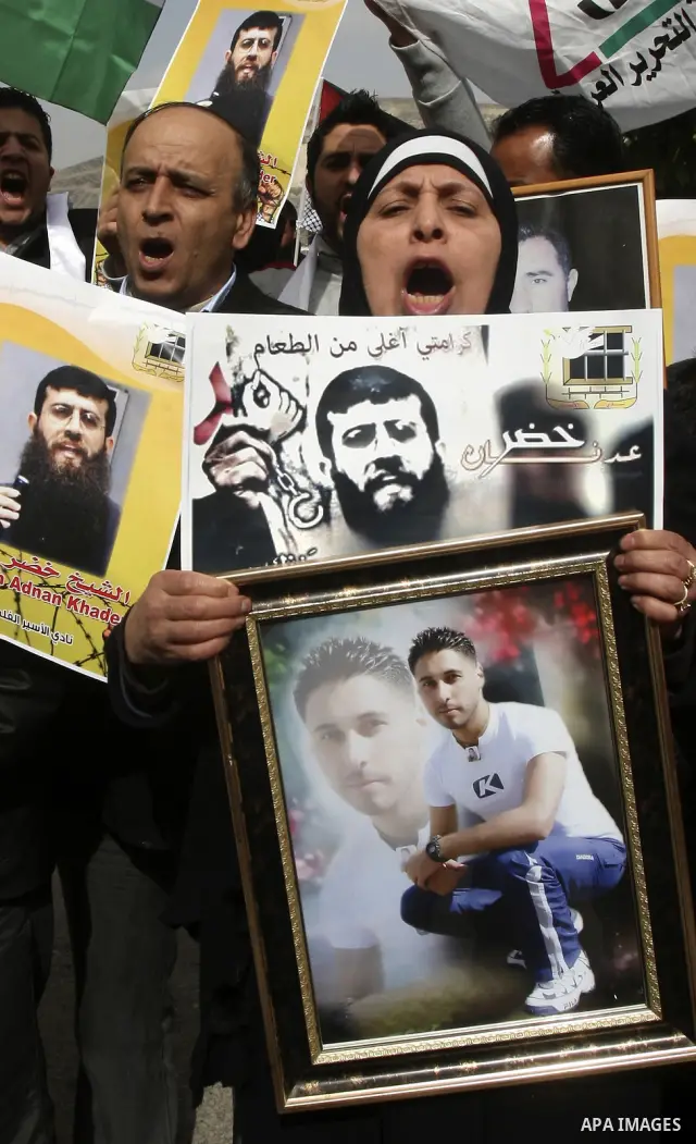 Palestinians demonstrate in solidarity with Khader Adnan, a senior member of Islamic Jihad jailed in Israel, who has been on a hunger strike for over seven weeks, during a protest in the West Bank city of Nablus, Feb. 7,...