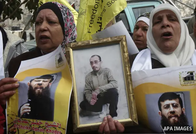 Palestinians demonstrate in solidarity with Khader Adnan, a senior member of Islamic Jihad jailed in Israel, who has been on a hunger strike for over seven weeks, during a protest in the West Bank city of Nablus, Feb. 7,...