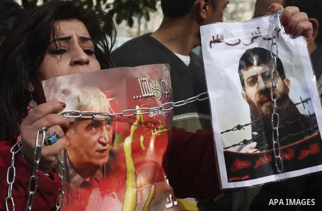 Palestinians demonstrate in solidarity with Khader Adnan, a senior member of Islamic Jihad jailed in Israel, who has been on a hunger strike for over seven weeks, during a protest in the West Bank city of Nablus, Feb. 7,...