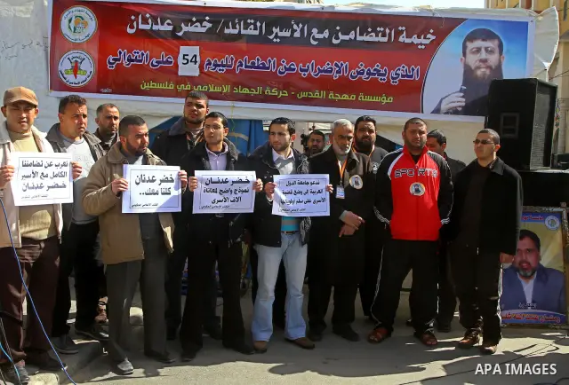 Palestinians protest of prisoner Khader Adnan, who has been on hunger strike since December 18 while being held in an Israeli jail, in Gaza city on Feb. 09, 2012. Photo by Ashraf Amra