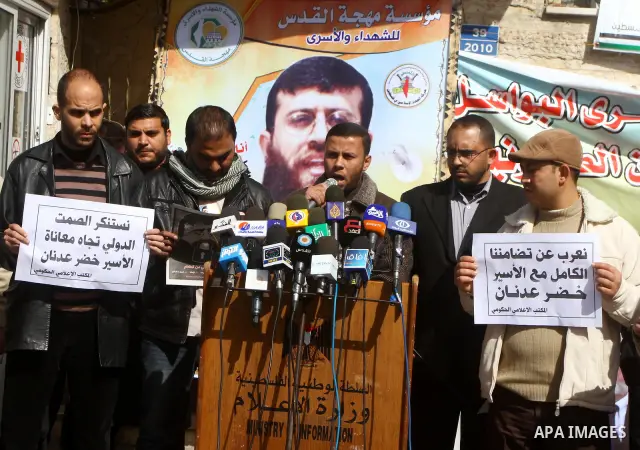 Palestinians protest of prisoner Khader Adnan, who has been on hunger strike since December 18 while being held in an Israeli jail, in Gaza city on Feb. 09, 2012. Photo by Ashraf Amra