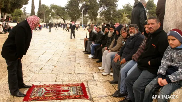 Palestinians attend Friday prayers at the Al-Aqsa Mosque compound in Jerusalem's Old City on February 10, 2012. Photo by Mahfouz Abu Turk