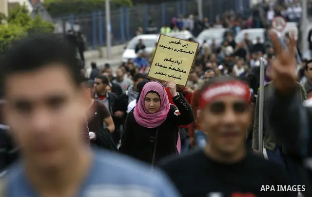 Demonstrators take part in a protest demanding that the army to hand power over to civilians, near the defence ministry in Cairo February 10, 2012. Egypt's religious authorities called on unions and youth groups to scrap...