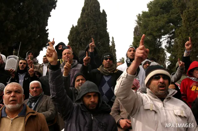 Palestinians protestors gather in front of Al-Aqsa mosque in the old city of Jerusalem, on February 12, 2012, as Israeli Police barred non-Muslims from visiting the Al-Aqsa mosque complex after right-wing Jewish activist...