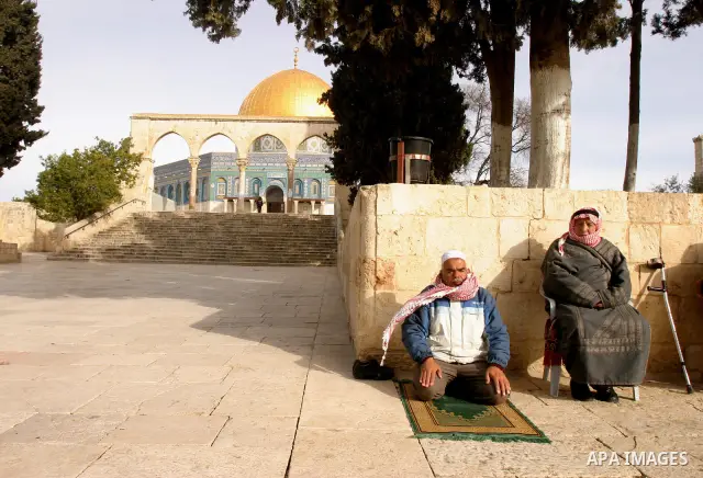 Palestinians protestors gather in front of Al-Aqsa mosque in the old city of Jerusalem, on February 12, 2012, as Israeli Police barred non-Muslims from visiting the Al-Aqsa mosque complex after right-wing Jewish activist...