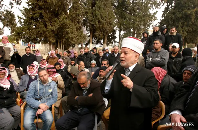 Palestinians protestors gather in front of Al-Aqsa mosque in the old city of Jerusalem, on February 12, 2012, as Israeli Police barred non-Muslims from visiting the Al-Aqsa mosque complex after right-wing Jewish activist...