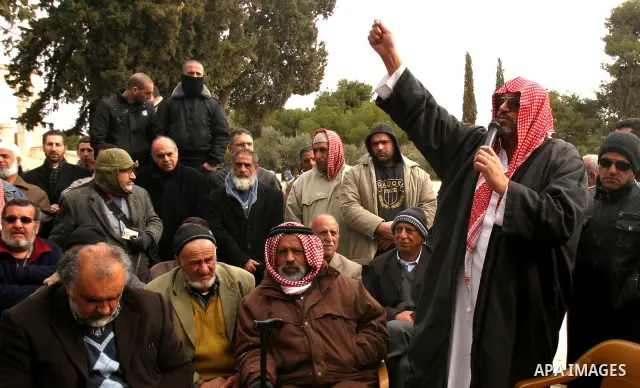 Palestinians protestors gather in front of Al-Aqsa mosque in the old city of Jerusalem, on February 12, 2012, as Israeli Police barred non-Muslims from visiting the Al-Aqsa mosque complex after right-wing Jewish activist...