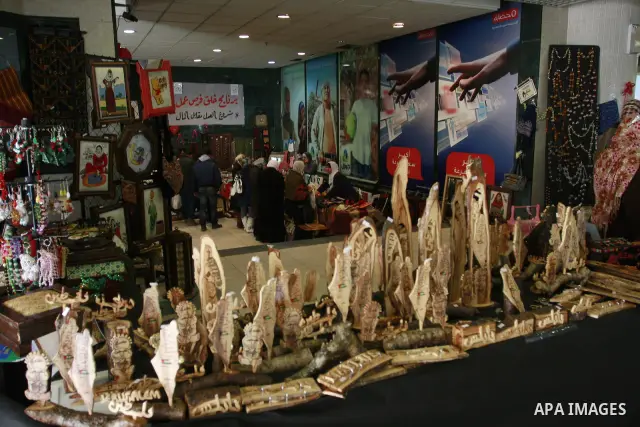 Palestinians participate in an exhibition for the Palestinian heritage in the West Bank city of Nablus, Sunday, Feb. 12, 2012 . Photo by Wagdi Eshtayah