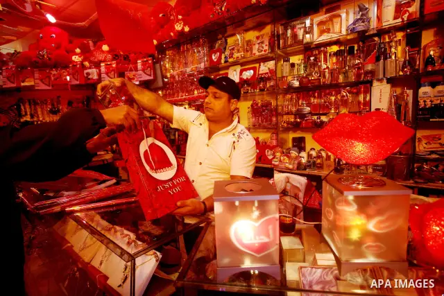 A Palestinian man decorates his shop during the Valentine's Day in Gaza City on Feb. 14, 2012. Valentine's Day is celebrated each year on 14 February. Photo by Ashraf Amra