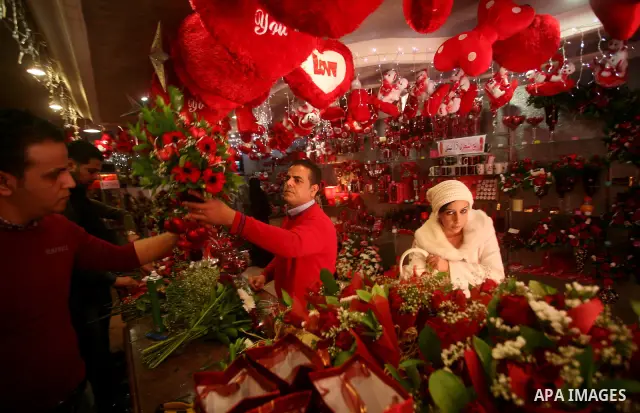 A Palestinian man decorates his shop during the Valentine's Day in Gaza City on Feb. 14, 2012. Valentine's Day is celebrated each year on 14 February. Photo by Ashraf Amra