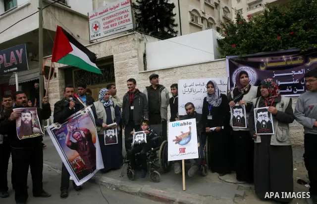 Palestinians,take part in a protest in front of French Center calling for release of Palestinian prisoner Khader Adnan, a member of the Islamic Jihad militant group, in Gaza City, February 14, 2012. Adnan has been on hun...