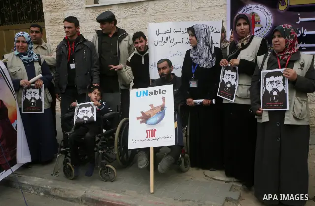 Palestinians,take part in a protest in front of French Center calling for release of Palestinian prisoner Khader Adnan, a member of the Islamic Jihad militant group, in Gaza City, February 14, 2012. Adnan has been on hun...